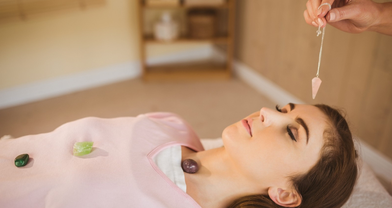 Young Woman At Crystal Healing Session.