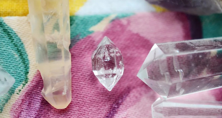 A Transparant Crystal Stones Placed On A Cloth.