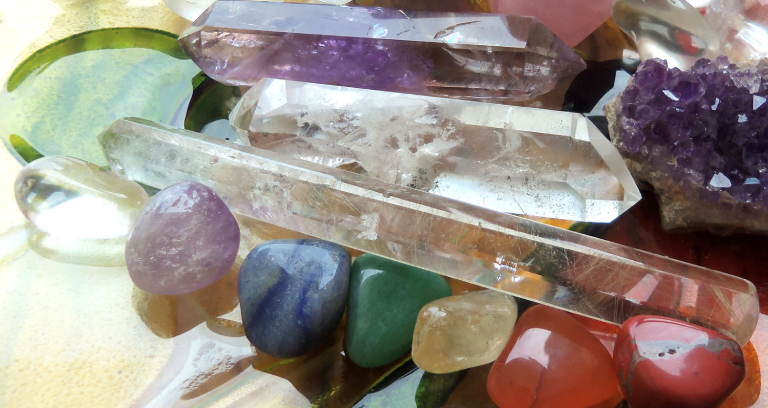 A Table Full of Crystal Stones & Illuminated Quartz.