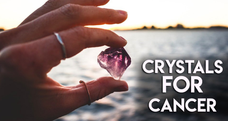 A Woman Holding A Small Crystal Representing Crystal For Cancer Patients.