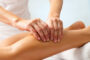 A Massage Therapist Doing Leg Massage For Her Patient.