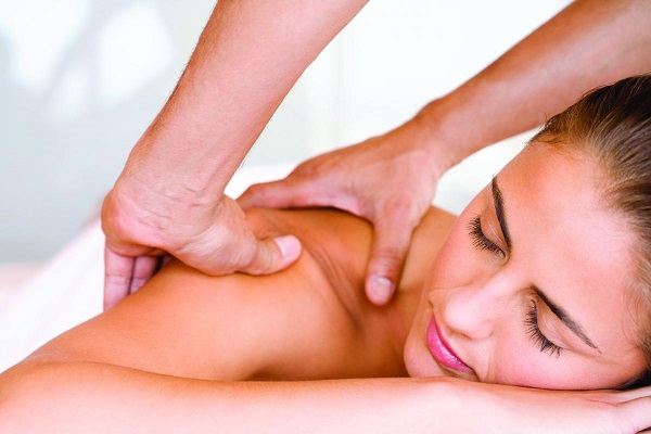 A Young Woman Get Relaxing While Massage Therapy.