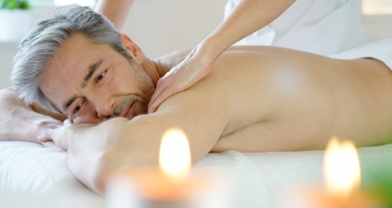 An Old Man Relaxing While Massaging.