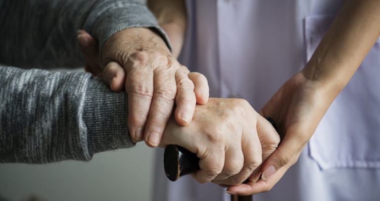 A Nurse Taking Care Of A Stroke Patient.