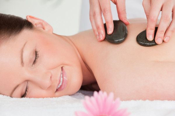 A Woman Getting Crystal Treatment From A therapist.