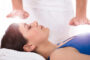 A Young Woman Getting Reiki Massage.