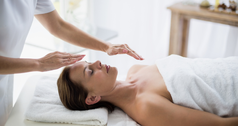 A Woman Getting Reiki Healing To Stay Away From Depression.