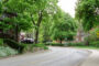 Rows of houses with trees in a neighborhood.